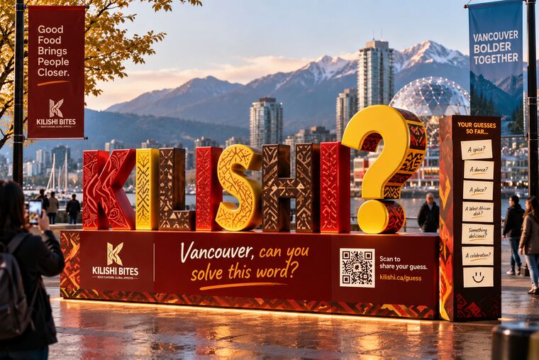 The same giant letter installation sited in Vancouver with mountains behind, captioned “Vancouver, can you solve this word?”