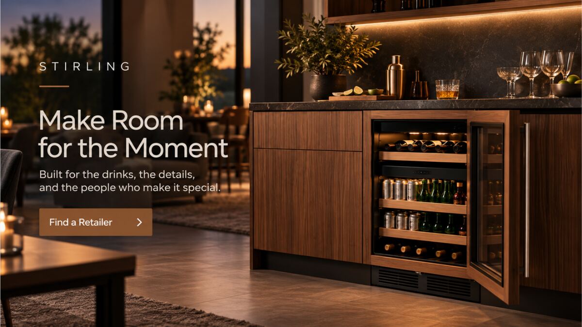 Walnut kitchen island at dusk with an integrated beverage cooler and the line “Make Room for the Moment”.