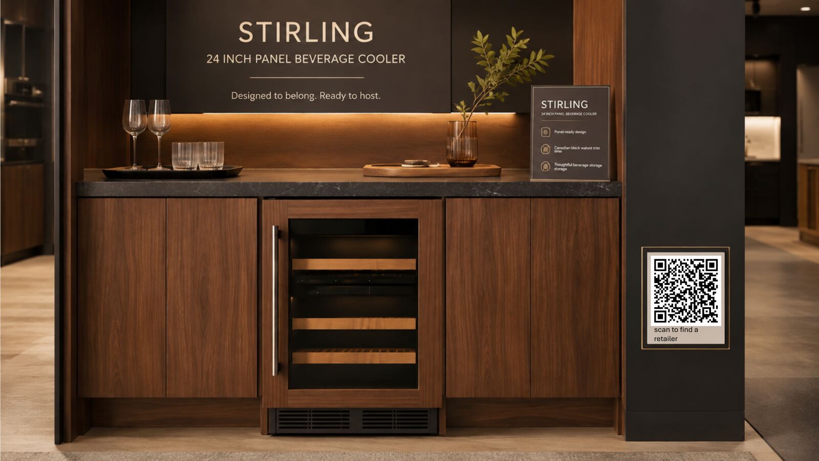 Stirling showroom vignette: a panel-ready beverage cooler set into warm walnut cabinetry with a charcoal stone counter, branded header and a QR panel reading “scan to find a retailer”.